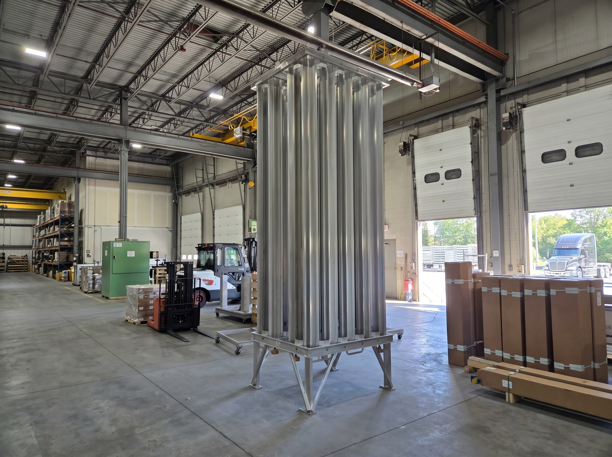 A finished FWM AV Series ambient-air vaporizer standing on the manufacturing floor in Hudson, New Hampshire