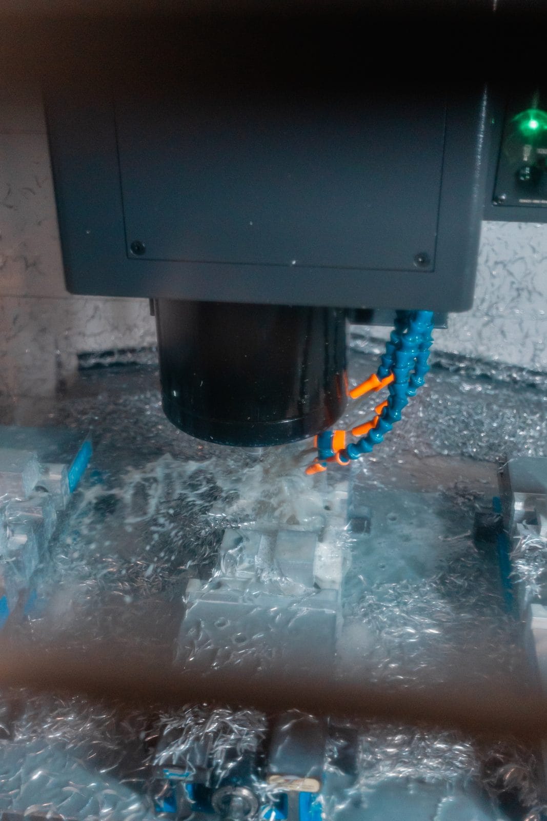 An FWM machinist operating a CNC machining center