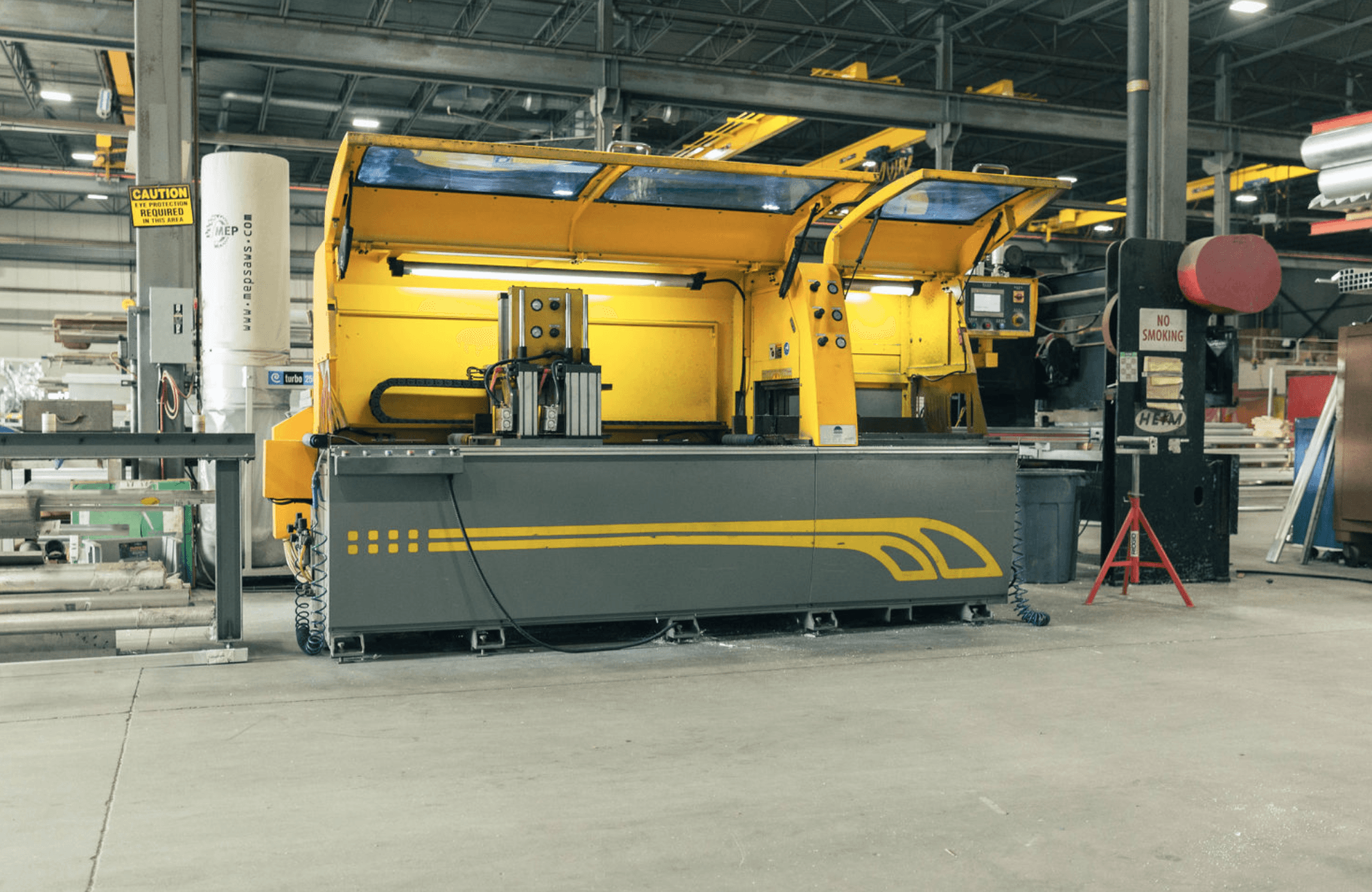 The yellow MEP automatic saw on the FWM production floor