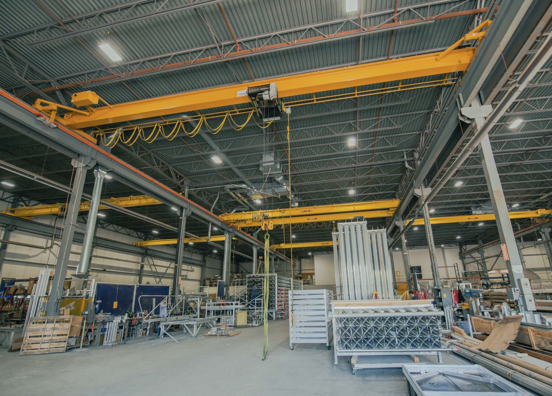 Overhead bridge cranes spanning the FWM manufacturing floor at the U.S. facility
