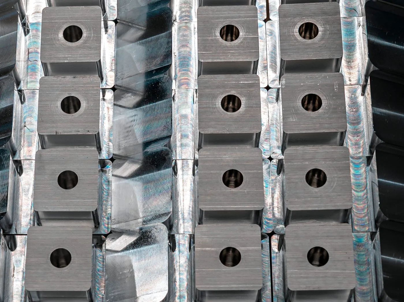 Precision-machined aluminum components staged for dimensional inspection at FWM