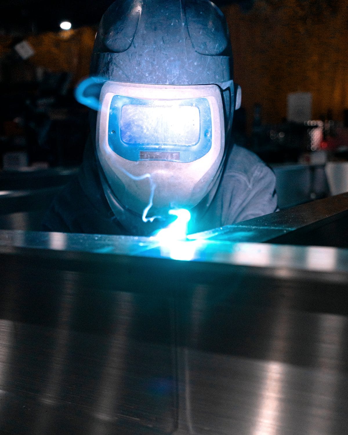 FWM welder TIG welding an aluminum assembly with a bright blue arc at the U.S. shop
